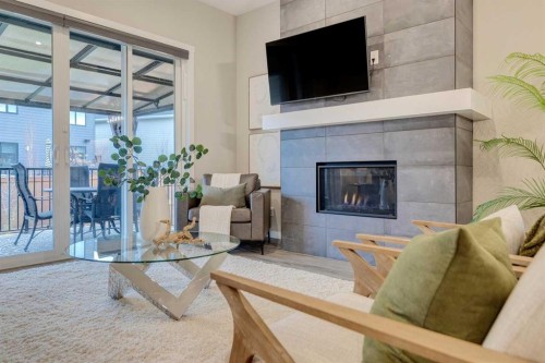 14 Cranbrook Common Se, Calgary, AB - Indoor Photo Showing Living Room With Fireplace