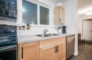 205-2440 34 Avenue Sw, Calgary, AB  - Indoor Photo Showing Kitchen With Double Sink 