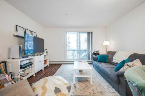 205-2440 34 Avenue Sw, Calgary, AB - Indoor Photo Showing Living Room