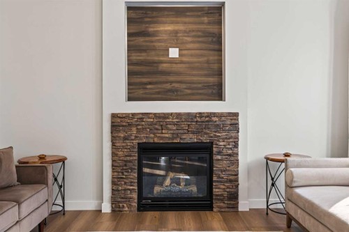 366 Bridleridge View Sw, Calgary, AB - Indoor Photo Showing Living Room With Fireplace
