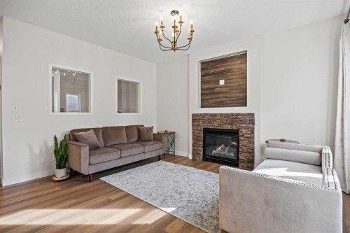 366 Bridleridge View Sw, Calgary, AB - Indoor Photo Showing Living Room With Fireplace
