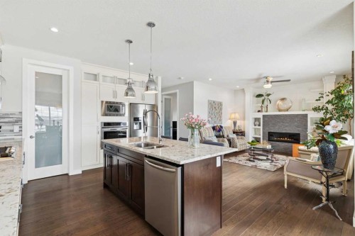 176 Cranarch Crescent Se, Calgary, AB - Indoor Photo Showing Kitchen With Fireplace With Double Sink With Upgraded Kitchen