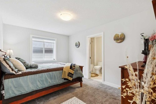 176 Cranarch Crescent Se, Calgary, AB - Indoor Photo Showing Bedroom