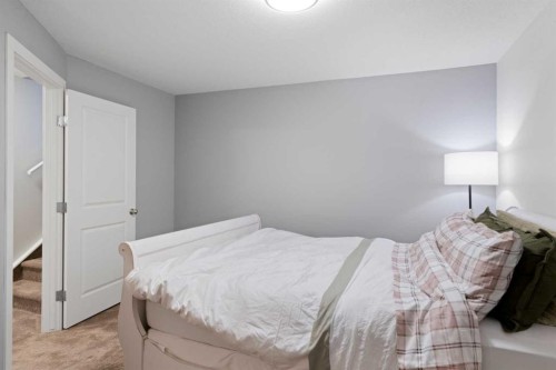 53 Riverside Crescent Se, Calgary, AB - Indoor Photo Showing Bedroom