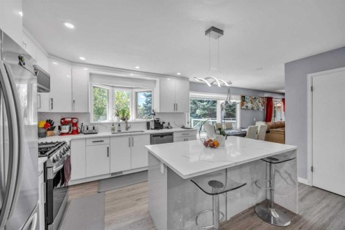 303 Ranchridge Bay Nw, Calgary, AB - Indoor Photo Showing Kitchen With Upgraded Kitchen