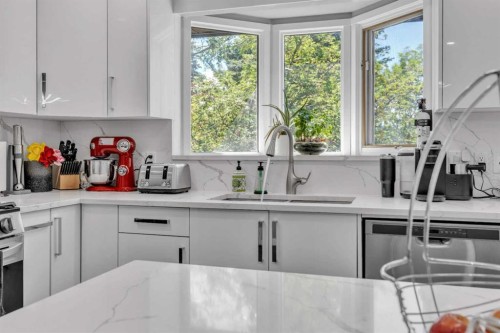 303 Ranchridge Bay Nw, Calgary, AB - Indoor Photo Showing Kitchen With Upgraded Kitchen