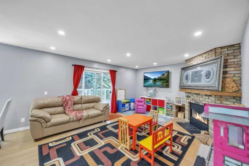 303 Ranchridge Bay Nw, Calgary, AB - Indoor With Fireplace