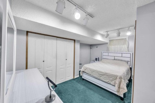 303 Ranchridge Bay Nw, Calgary, AB - Indoor Photo Showing Bedroom