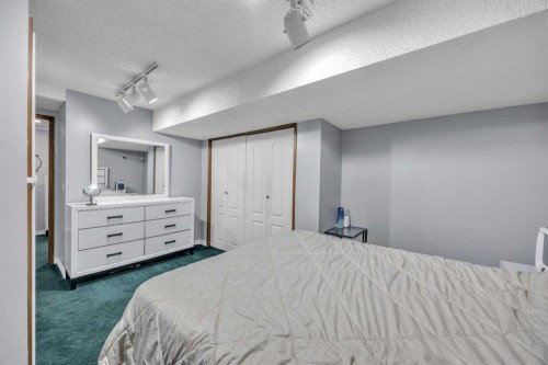 303 Ranchridge Bay Nw, Calgary, AB - Indoor Photo Showing Bedroom