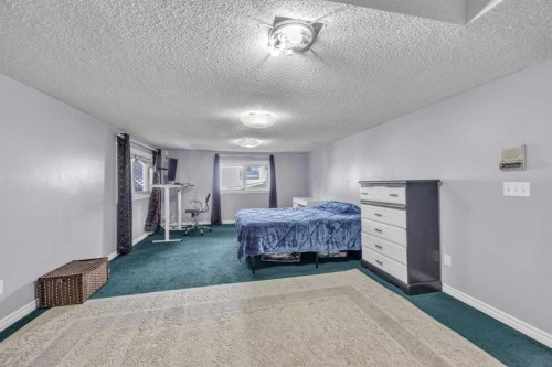 303 Ranchridge Bay Nw, Calgary, AB - Indoor Photo Showing Bedroom