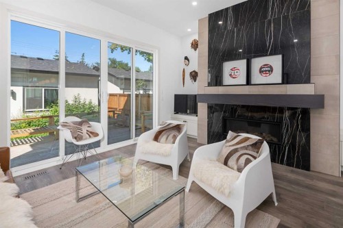 2126B 52 Avenue Sw, Calgary, AB - Indoor Photo Showing Living Room With Fireplace