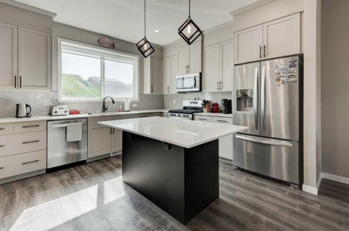 100 Dawson Drive, Chestermere, AB - Indoor Photo Showing Kitchen With Upgraded Kitchen
