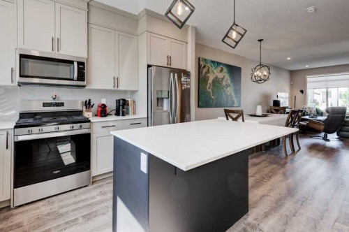 100 Dawson Drive, Chestermere, AB - Indoor Photo Showing Kitchen With Upgraded Kitchen