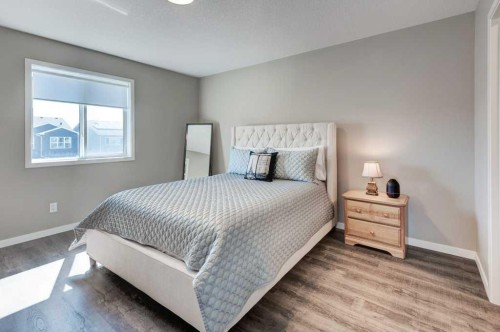 100 Dawson Drive, Chestermere, AB - Indoor Photo Showing Bedroom