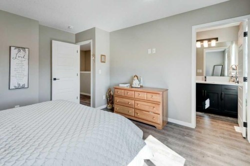 100 Dawson Drive, Chestermere, AB - Indoor Photo Showing Bedroom