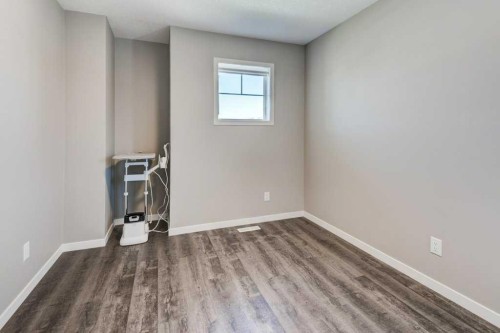 100 Dawson Drive, Chestermere, AB - Indoor Photo Showing Other Room