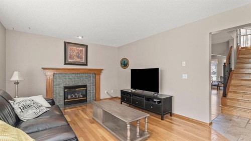 227 Rocky Ridge Close Nw, Calgary, AB - Indoor Photo Showing Living Room With Fireplace