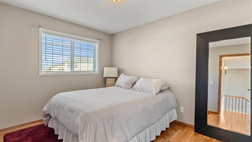 227 Rocky Ridge Close Nw, Calgary, AB - Indoor Photo Showing Bedroom