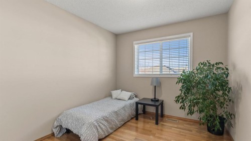 227 Rocky Ridge Close Nw, Calgary, AB - Indoor Photo Showing Bedroom