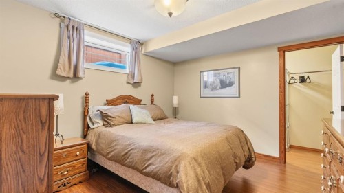 227 Rocky Ridge Close Nw, Calgary, AB - Indoor Photo Showing Bedroom