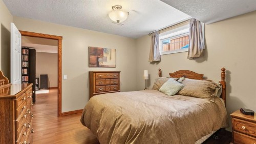227 Rocky Ridge Close Nw, Calgary, AB - Indoor Photo Showing Bedroom
