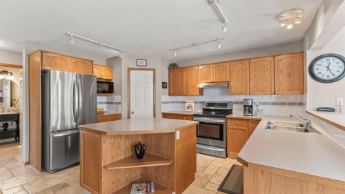 227 Rocky Ridge Close Nw, Calgary, AB - Indoor Photo Showing Kitchen With Double Sink