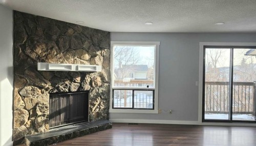 257 Macewan Glen Drive Nw, Calgary, AB - Indoor With Fireplace