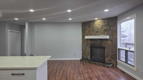 257 Macewan Glen Drive Nw, Calgary, AB - Indoor With Fireplace