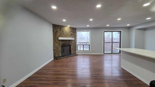 257 Macewan Glen Drive Nw, Calgary, AB - Indoor With Fireplace