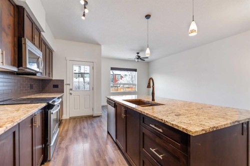 51 Legacy Close Se, Calgary, AB - Indoor Photo Showing Kitchen With Double Sink With Upgraded Kitchen