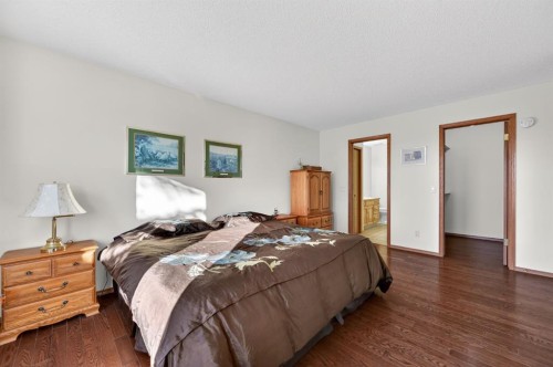 206 Arbour Cliff Close Nw, Calgary, AB - Indoor Photo Showing Bedroom