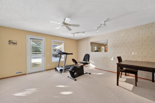 206 Arbour Cliff Close Nw, Calgary, AB - Indoor Photo Showing Gym Room
