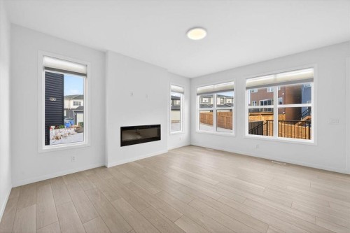 392 Carringvue Place Nw, Calgary, AB - Indoor Photo Showing Living Room With Fireplace