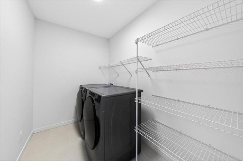 392 Carringvue Place Nw, Calgary, AB - Indoor Photo Showing Laundry Room