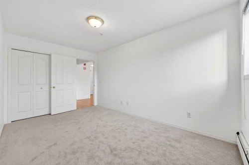210-165 Manora Place Ne, Calgary, AB - Indoor Photo Showing Other Room