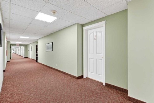 210-165 Manora Place Ne, Calgary, AB - Indoor Photo Showing Other Room
