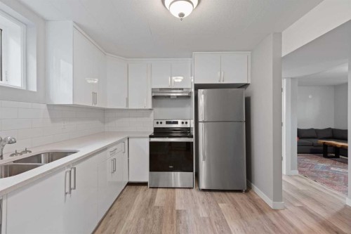 228 Lynnwood Drive Se, Calgary, AB - Indoor Photo Showing Kitchen With Stainless Steel Kitchen With Double Sink With Upgraded Kitchen