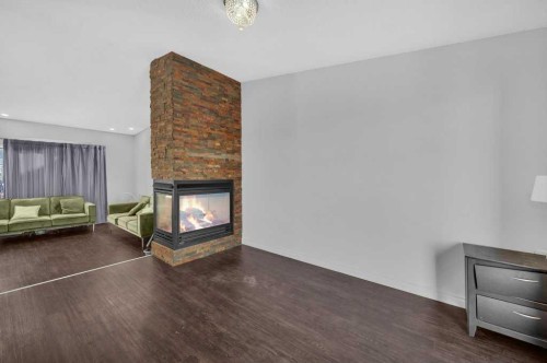 64 Castledale Crescent Ne, Calgary, AB - Indoor With Fireplace