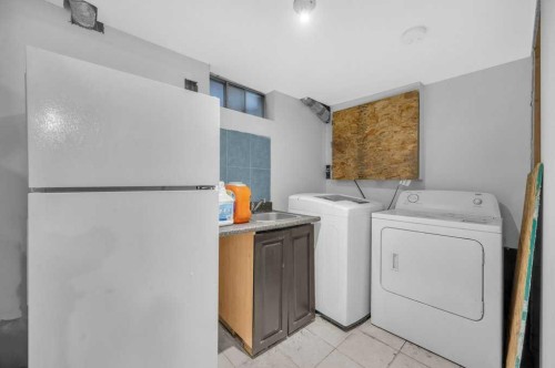 64 Castledale Crescent Ne, Calgary, AB - Indoor Photo Showing Laundry Room