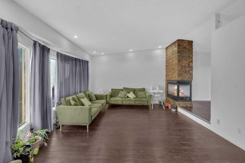 64 Castledale Crescent Ne, Calgary, AB - Indoor Photo Showing Other Room With Fireplace
