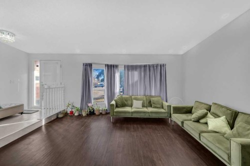64 Castledale Crescent Ne, Calgary, AB - Indoor Photo Showing Living Room