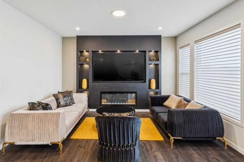 86 Creekside Way Sw, Calgary, AB - Indoor Photo Showing Living Room With Fireplace