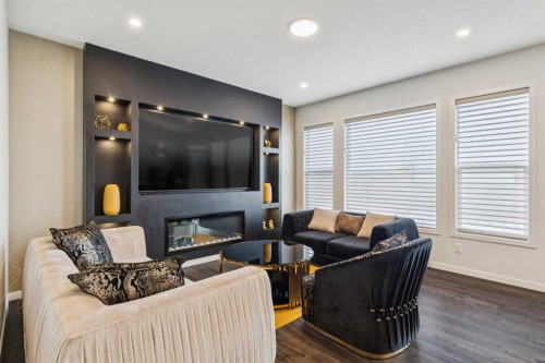 86 Creekside Way Sw, Calgary, AB - Indoor Photo Showing Living Room With Fireplace