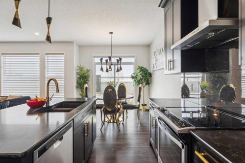 86 Creekside Way Sw, Calgary, AB - Indoor Photo Showing Kitchen With Stainless Steel Kitchen With Double Sink With Upgraded Kitchen