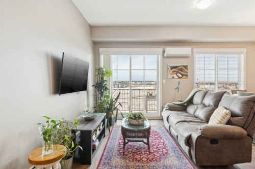 4401-99 Copperstone Park Se, Calgary, AB - Indoor Photo Showing Living Room