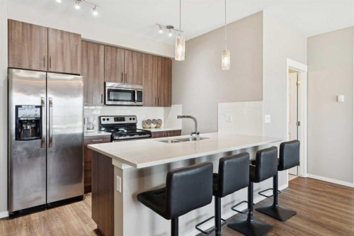 4401-99 Copperstone Park Se, Calgary, AB - Indoor Photo Showing Kitchen With Stainless Steel Kitchen With Double Sink With Upgraded Kitchen
