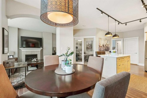 305-4 14 Street Nw, Calgary, AB - Indoor Photo Showing Dining Room With Fireplace