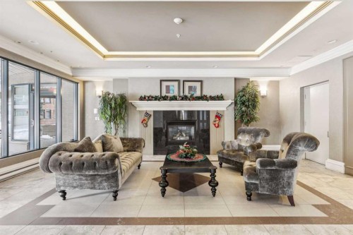 305-4 14 Street Nw, Calgary, AB - Indoor Photo Showing Living Room With Fireplace