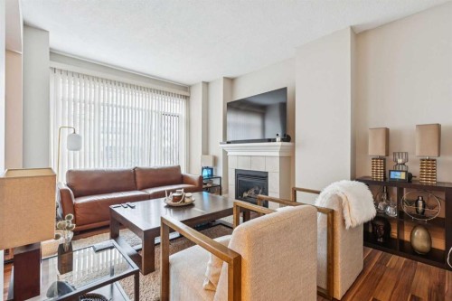 305-4 14 Street Nw, Calgary, AB - Indoor Photo Showing Living Room With Fireplace