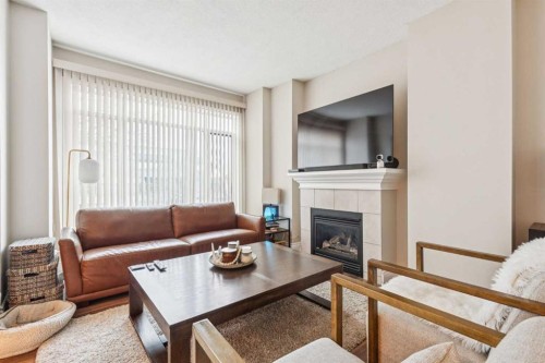 305-4 14 Street Nw, Calgary, AB - Indoor Photo Showing Living Room With Fireplace